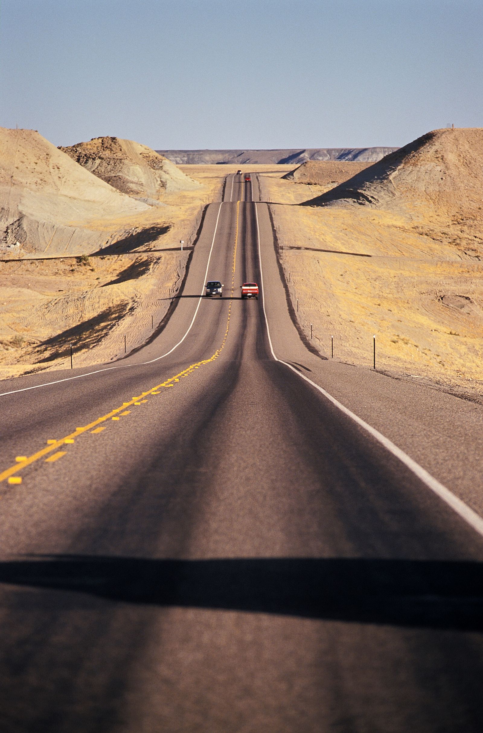 An empty interstate highway stretching to the horizon